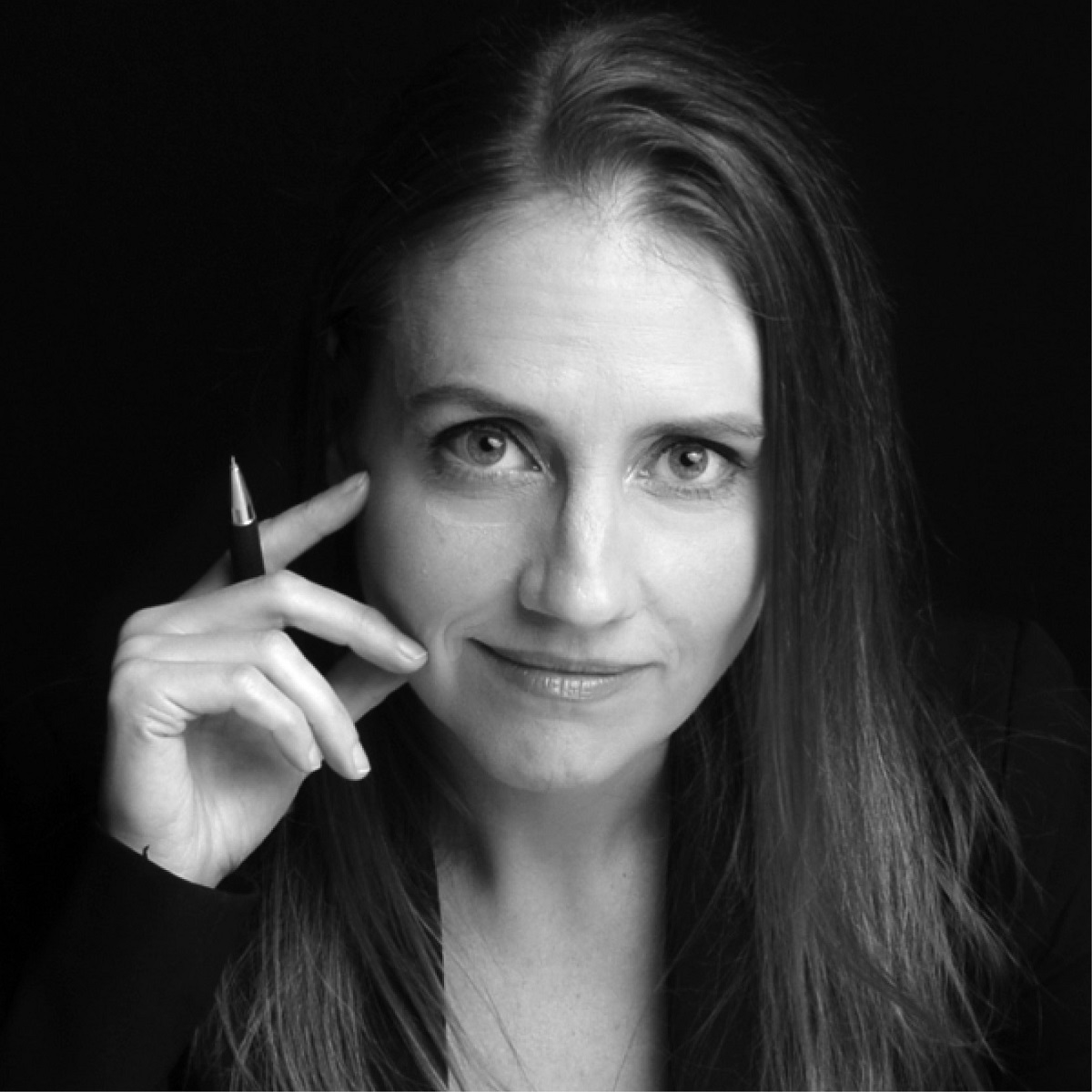 Rebecca Pellett holding a pen